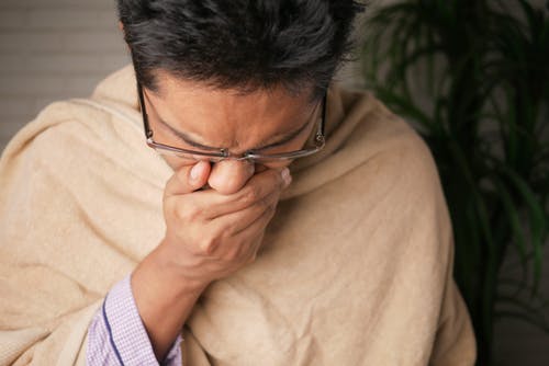 Home remedies for cough- A man Coughing