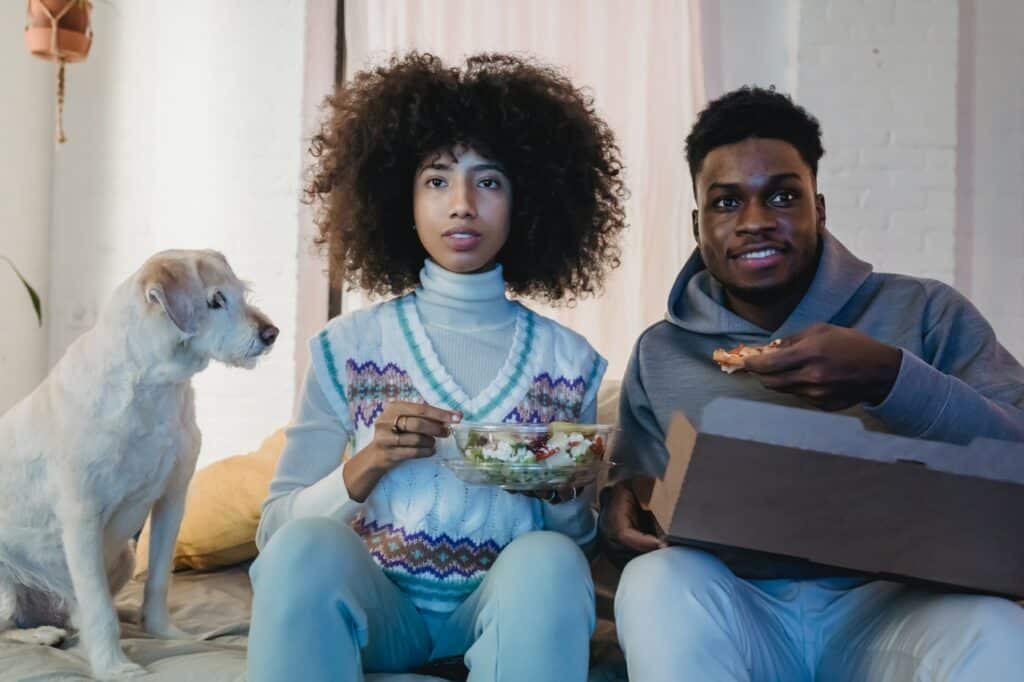 Dog and a couple eating food